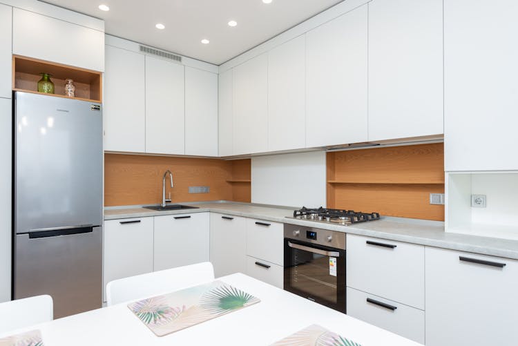 Modern Kitchen Interior With Cabinets And Fridge At Home