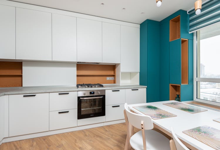 Contemporary Kitchen Interior With Furniture In Flat