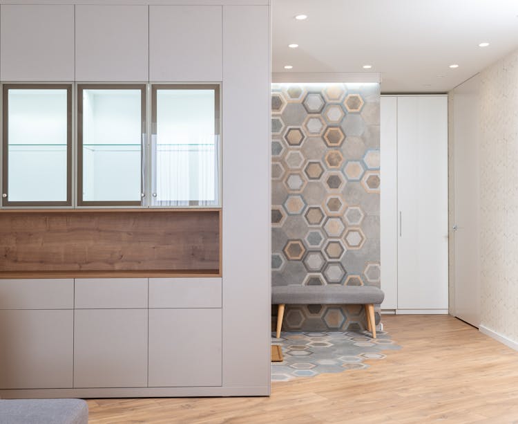 Kitchen Furniture Against Textile Bench And Ornamental Wall At Home