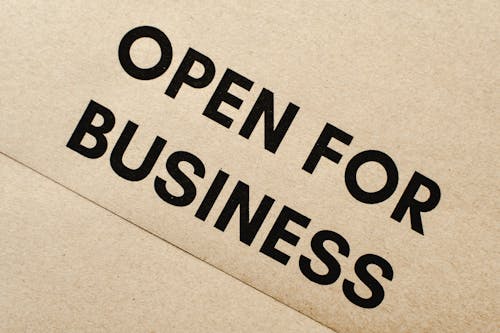 Close-Up Shot of an Open for Business Text on an Envelope