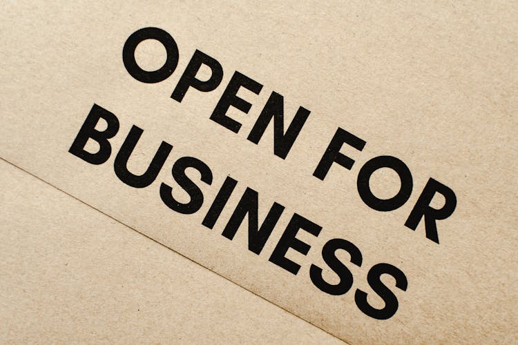 Close-Up Shot Of An Open For Business Text On An Envelope