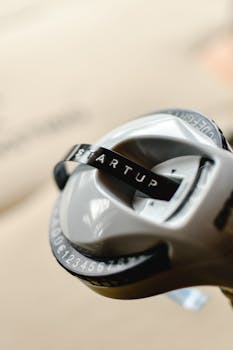 High-quality close-up of a label maker printing the word 'STARTUP', symbolizing new business ventures.