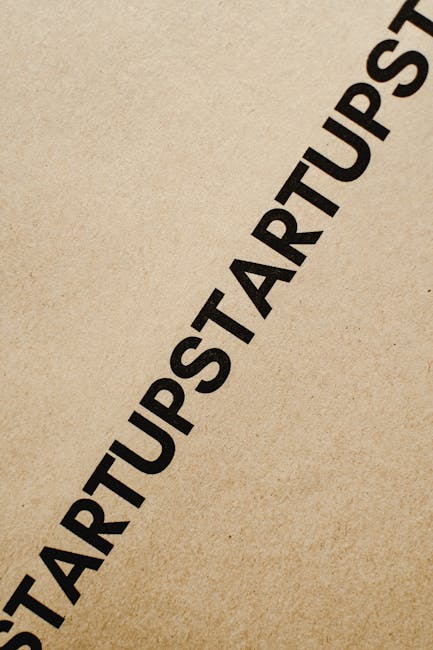 Diagonal black text 'STARTUP' on brown paper, perfect for conceptual business themes.
