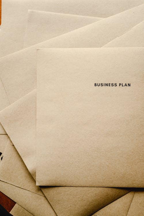 Free Close-Up Shot of a Business Plan Text on a Brown Paper Stock Photo