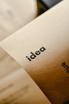 Close-up shot of the word 'idea' printed on brown paper, perfect for representing creativity and startups.