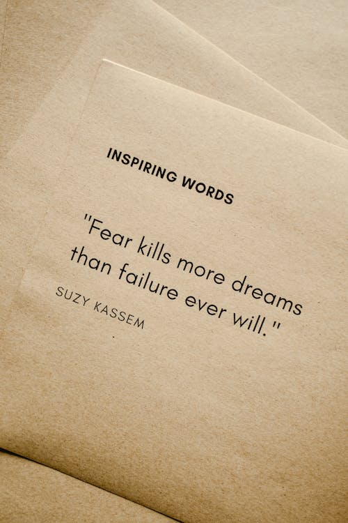 Close-Up Shot of Inspiring Words on a Brown Paper