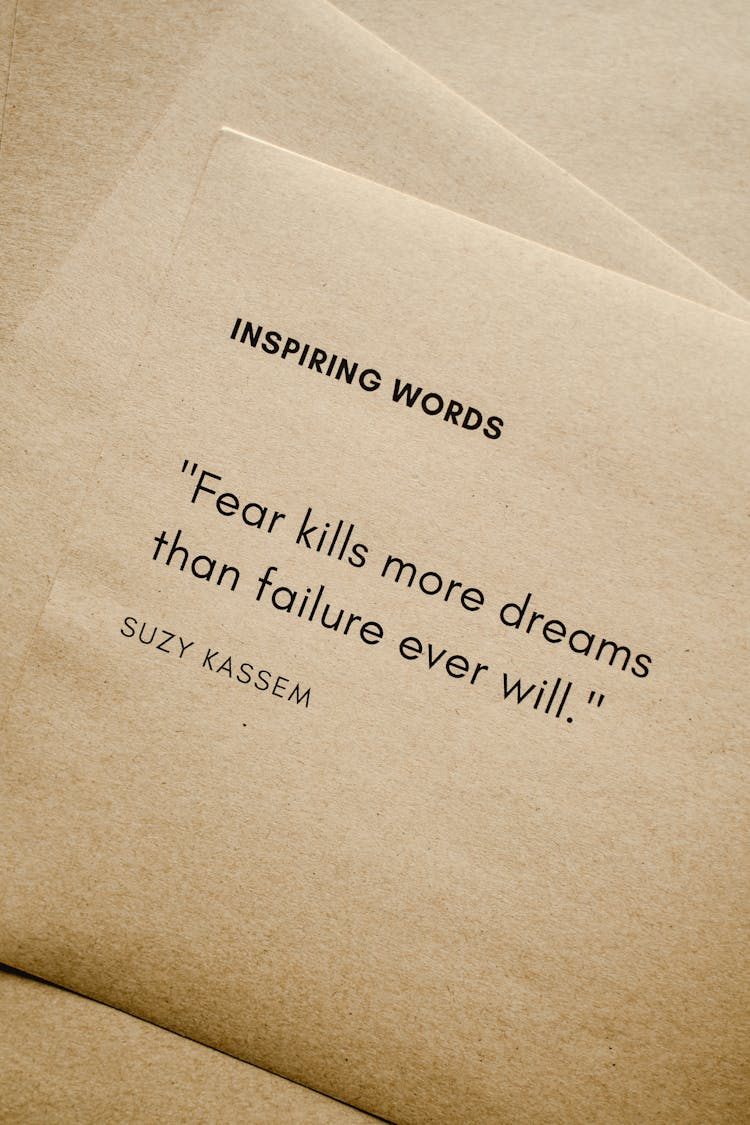 Close-Up Shot Of Inspiring Words On A Brown Paper