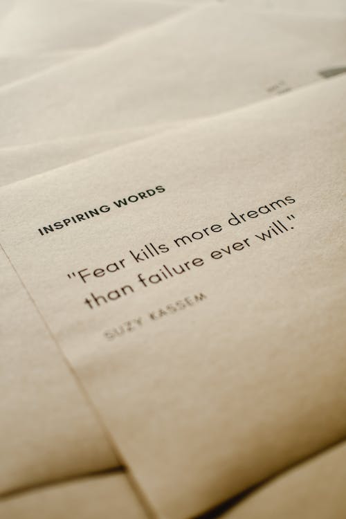 Free Close-Up Shot of Inspiring Words on a Brown Paper Stock Photo