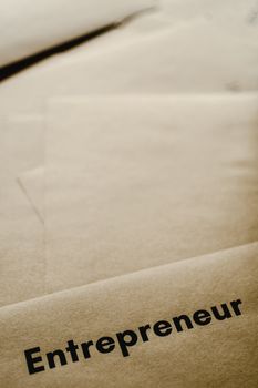 A close-up of brown paper with the word 'entrepreneur,' inspiring business and creativity.