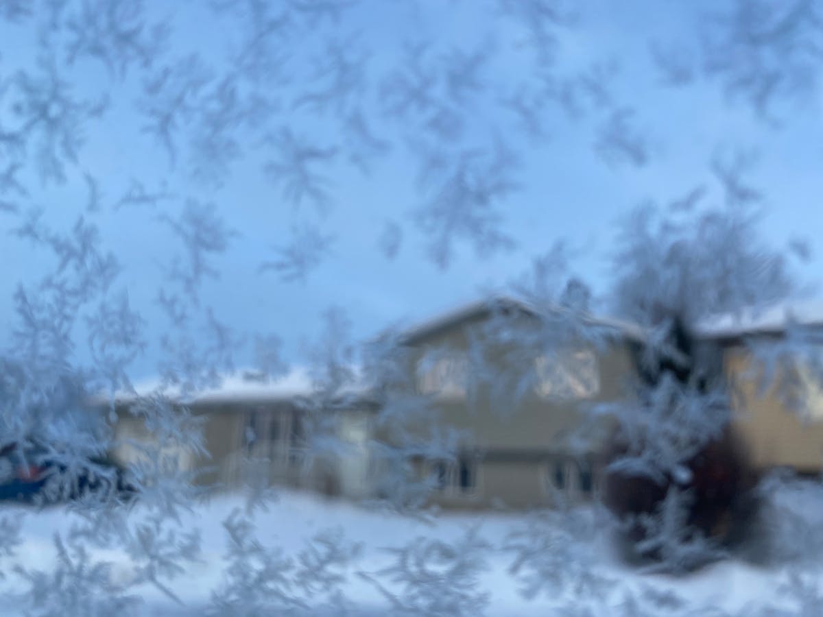 Busy Lagos street with commuters and yellow buses