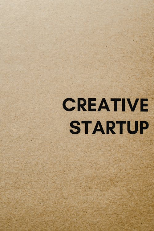 Free Close-Up Shot of a Creative Startup Text on a Brown Paper Stock Photo