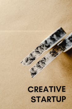 Artistic brown paper background with decorative tape representing a creative startup theme.