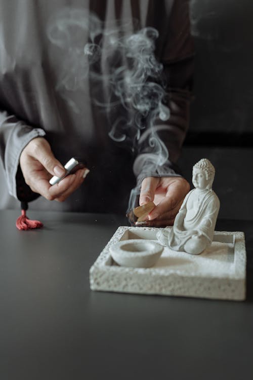 A Person Lighting a Palo Santo