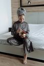 Woman in Gray Hijab Holding Clear Glass Bowl