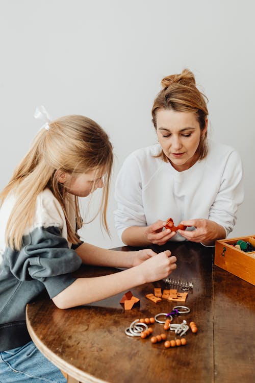 Women Playing with Wooden Toys