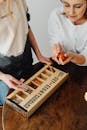 Women Tying to Solve Toy Puzzles