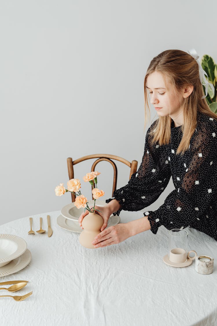 A Girl Setting A Table