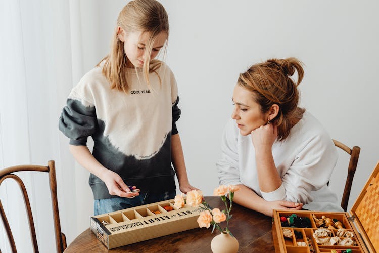 Women Playing Brain Teaser Toys Puzzle