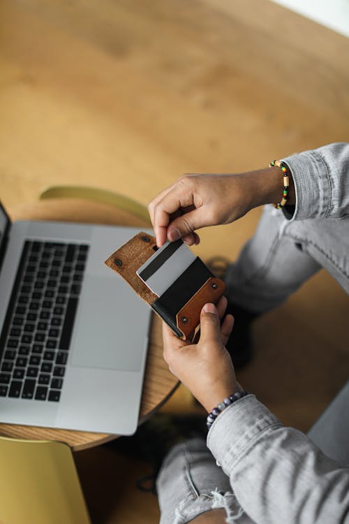 Person Holding White Credit Card