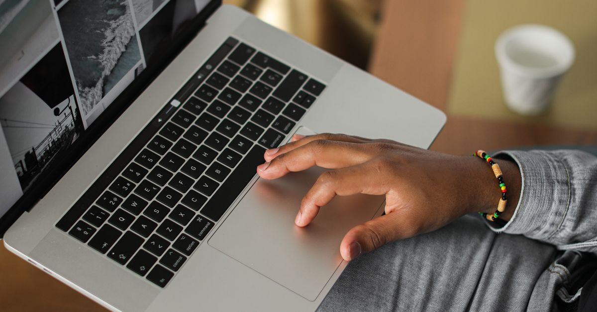 Browsing Computer Picture A Person Browsing Images in a Laptop · Free Stock Photo