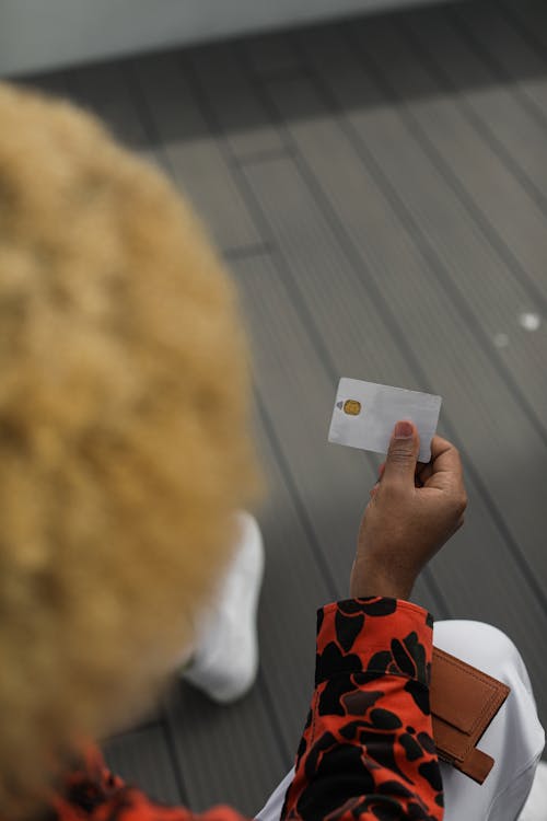 Free A Person Holding a Card Stock Photo