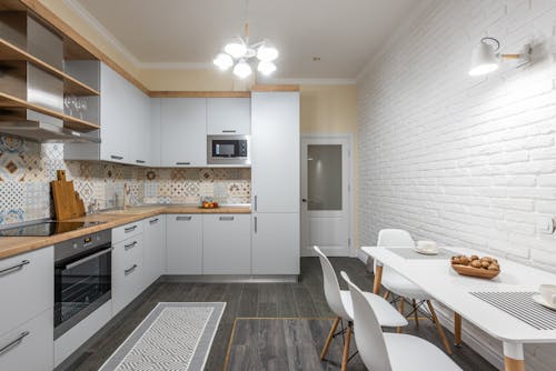 Modern kitchen interior with furniture and shiny chandelier