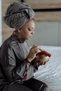 Focused Woman using Tibetan Singing Bowl
