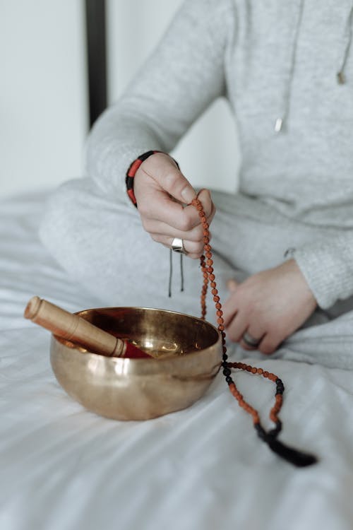 A Person Meditating in Bed