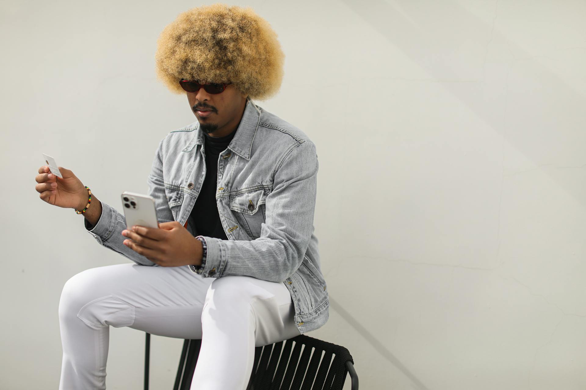 Man Doing Online Shopping Using A Smartphone And Credit Card