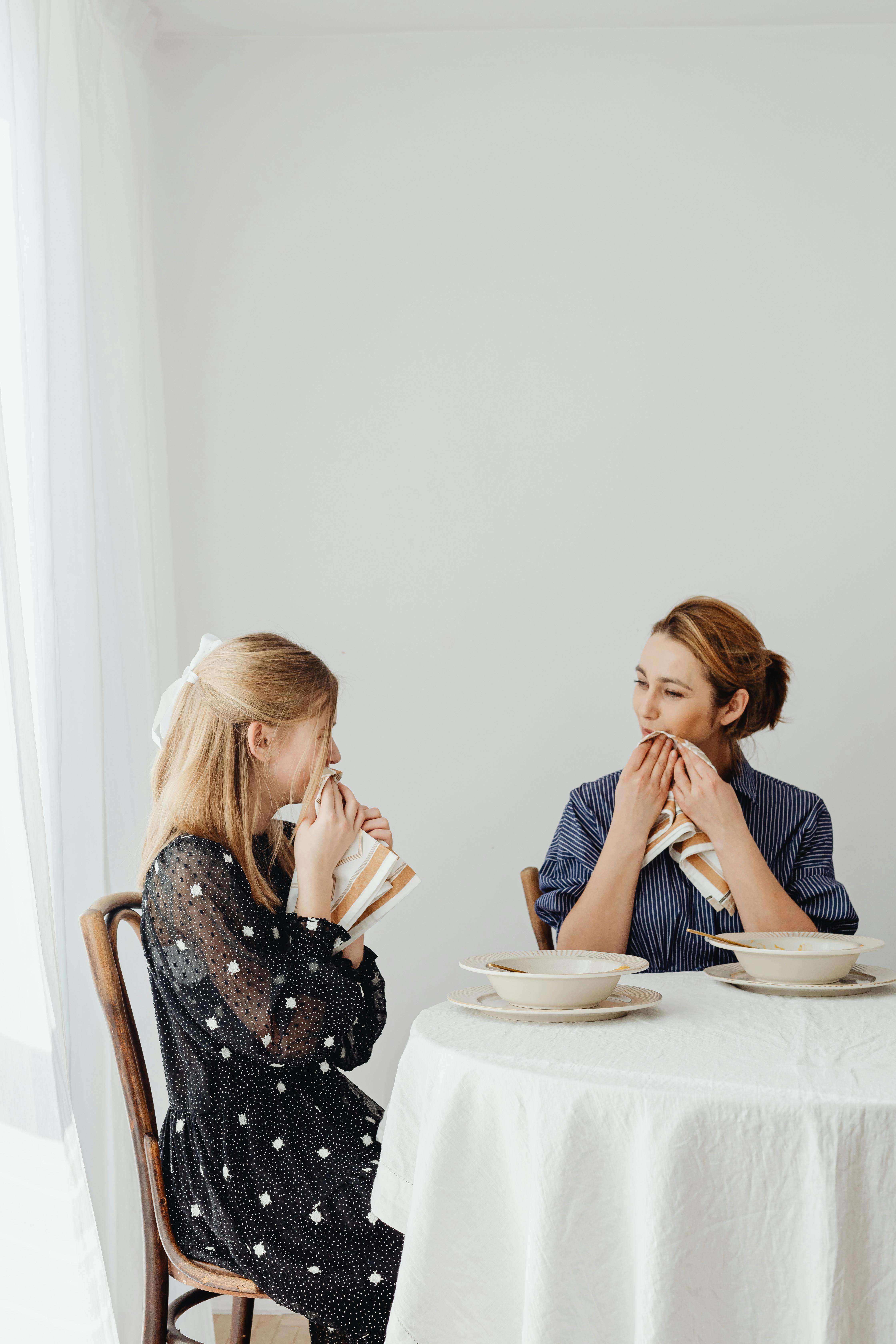 Young women clean the table Stock Photo by ©photographee.eu 117322610