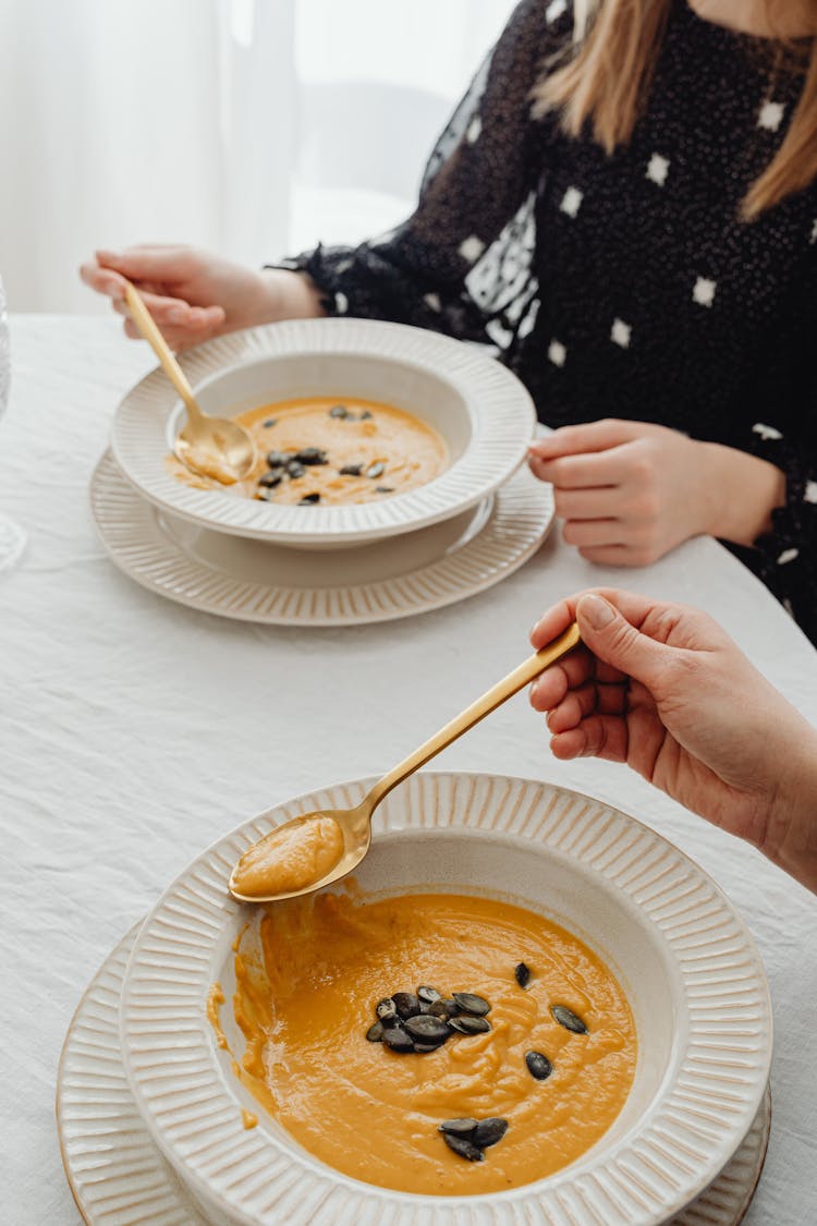 People Eating Pumpkin Soup