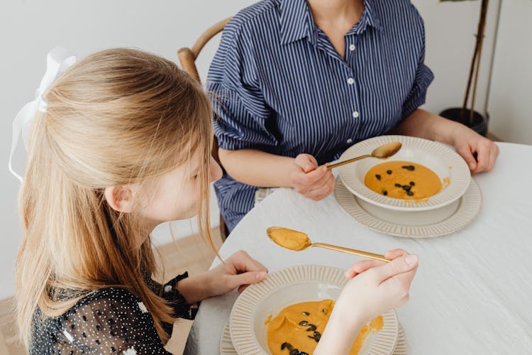 Women Eating Pumpkin Soup