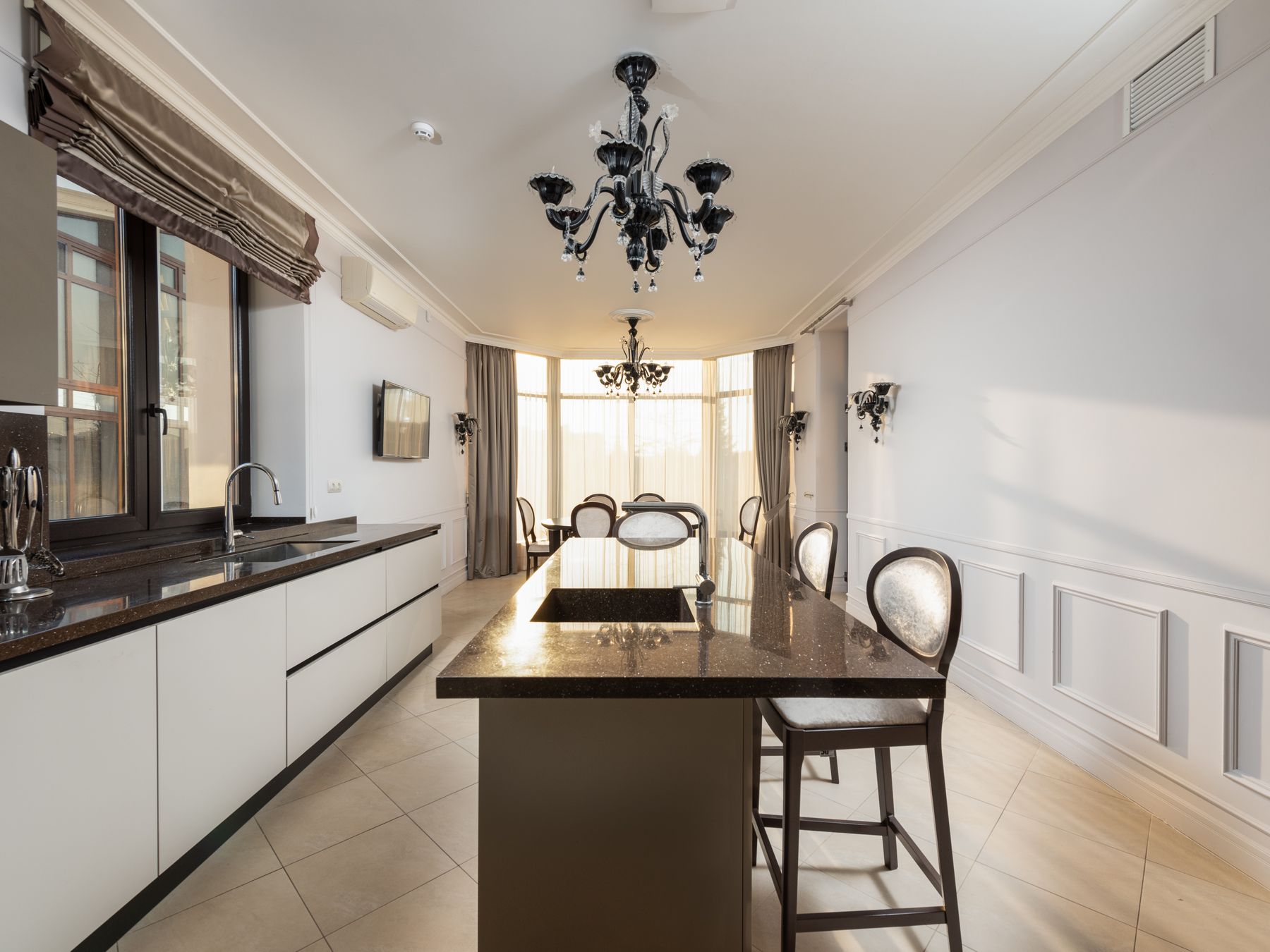 Kitchen Spraying in Fitzrovia — a decorator at work mid-project
