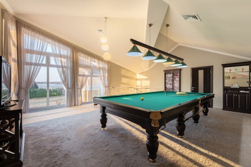 Free Pool table in modern building Stock Photo