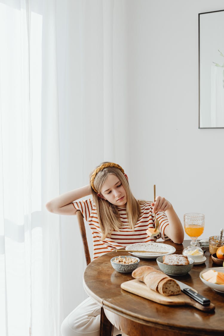 Teenager Holding A Fork