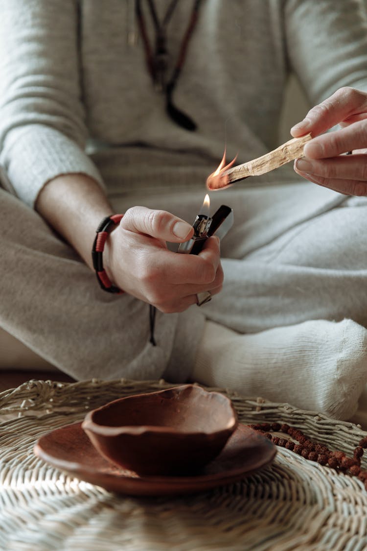 Close Up Photo Of Person Burning Palo Santo