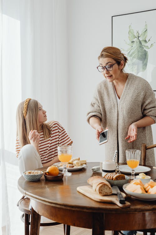 Free Mother And Daughter Arguing During Breakfast Stock Photo