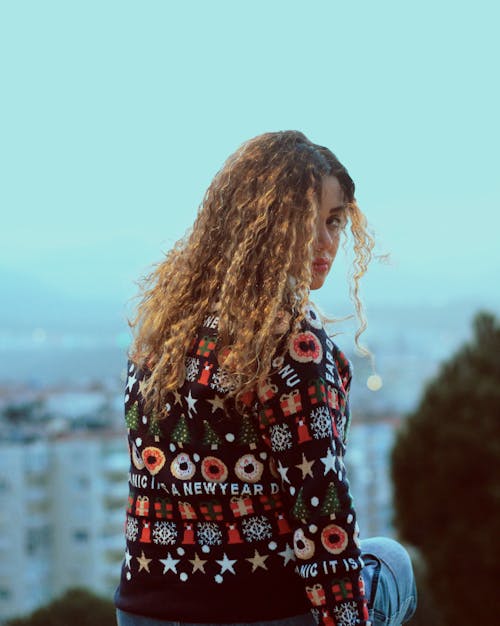 Woman With Curly Hair Wearing Printed Shirt 