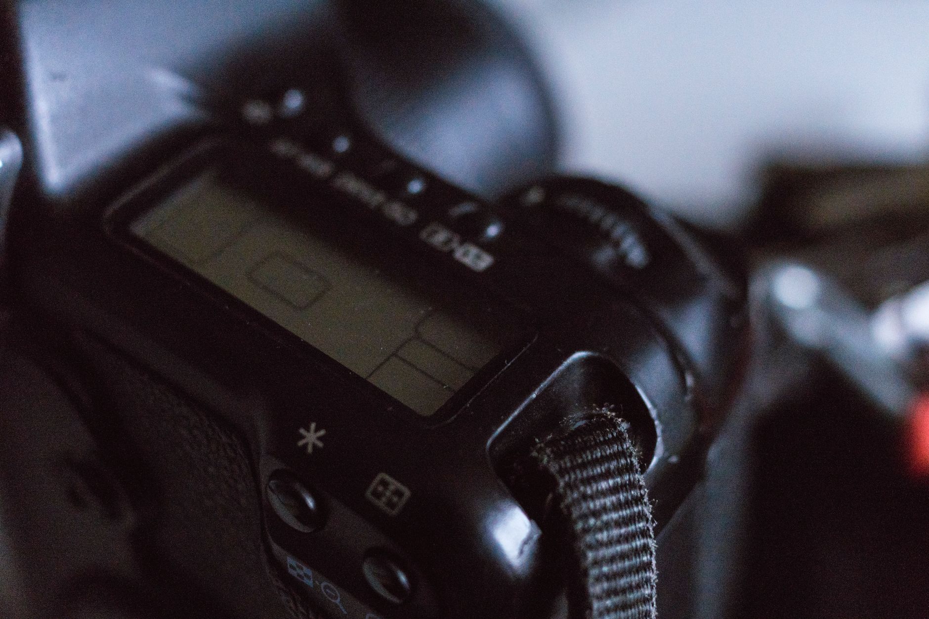 Close-up image of a DSLR camera's digital screen showing settings in focus.