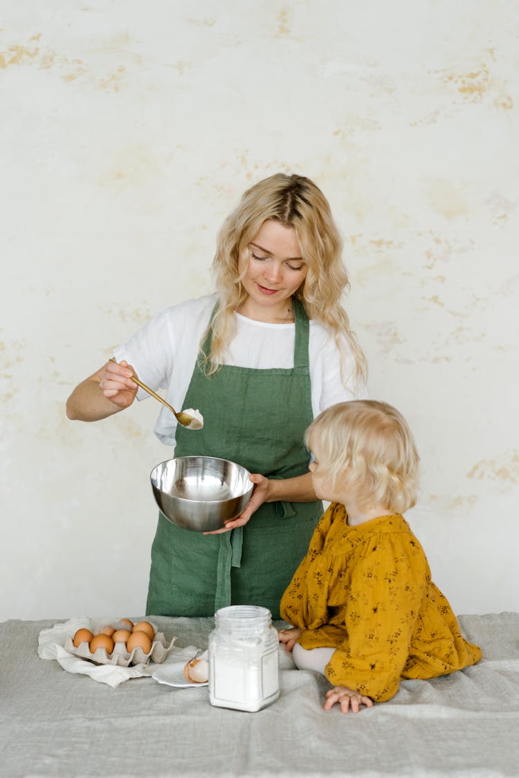 Mother And Daughter Baking Together