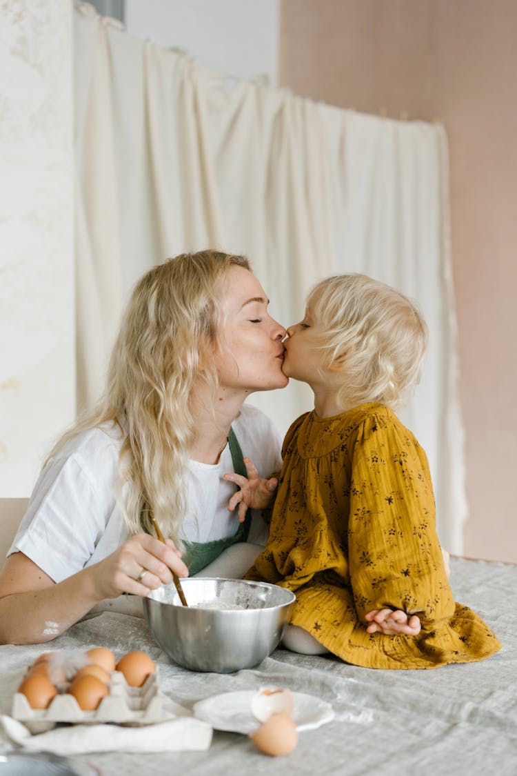 Woman Kissing A Toddler