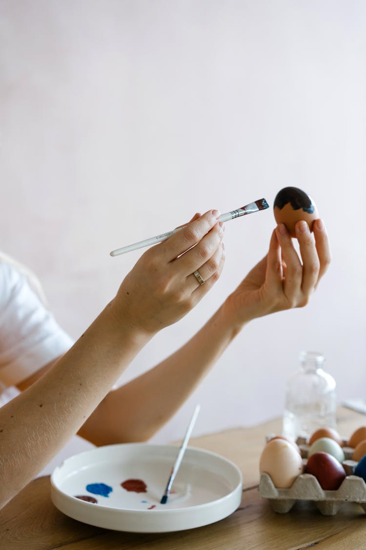 Person Coloring An Egg