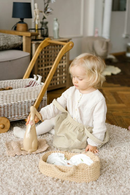 Free Cute Toddler playing with Baby Toys  Stock Photo