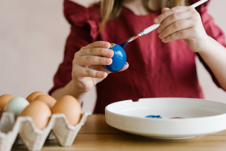 A Person Painting Egg