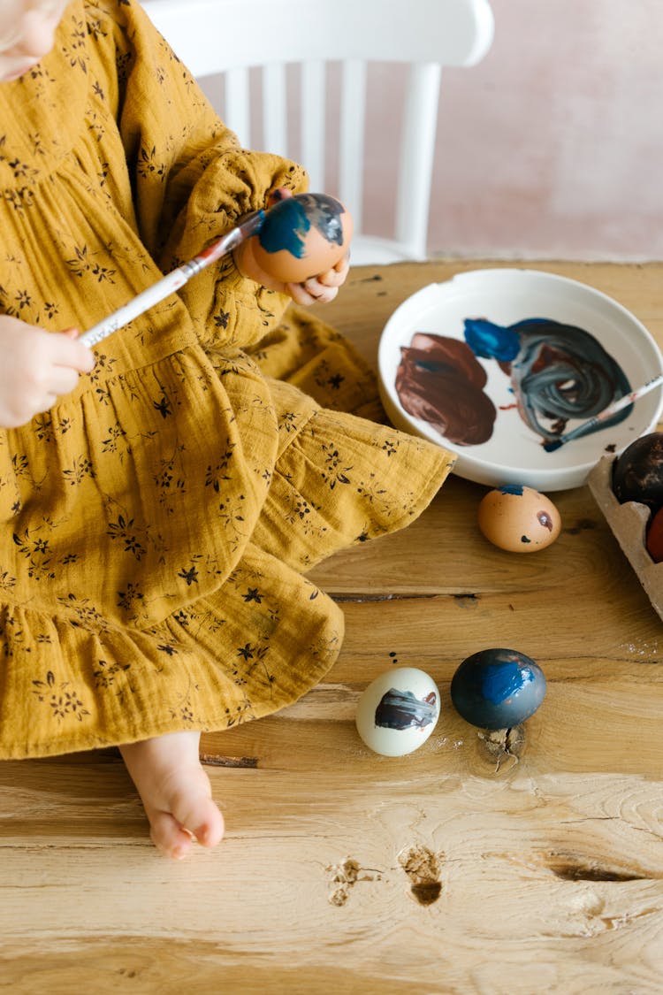 Person In Yellow Dress Holding Paint Brush