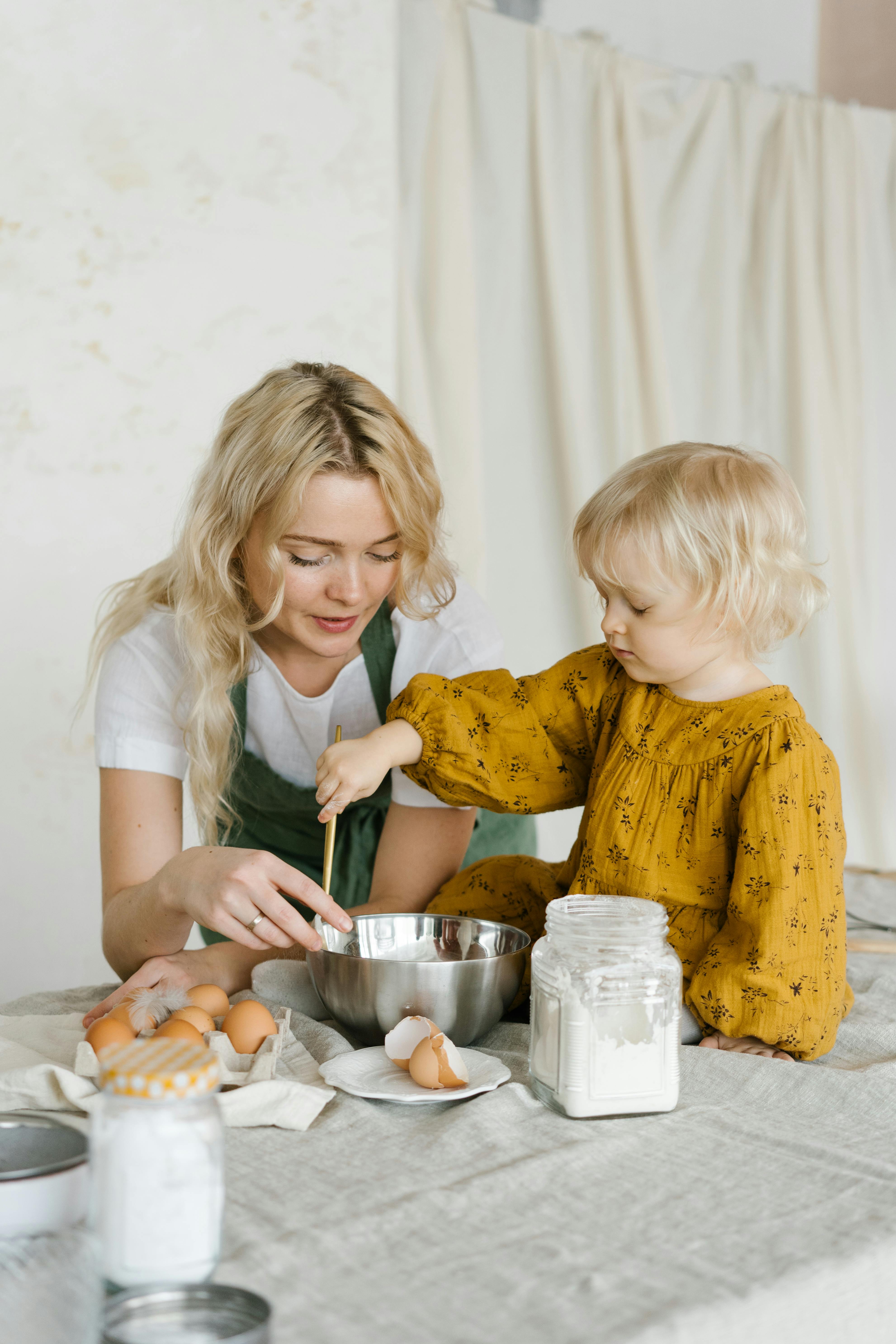 a mother baking with her daughter