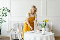 Woman in Yellow Dress Sitting on White Chair