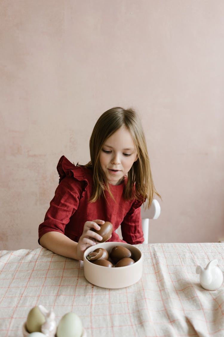 Amazed Girl Looking At Easter Eggs