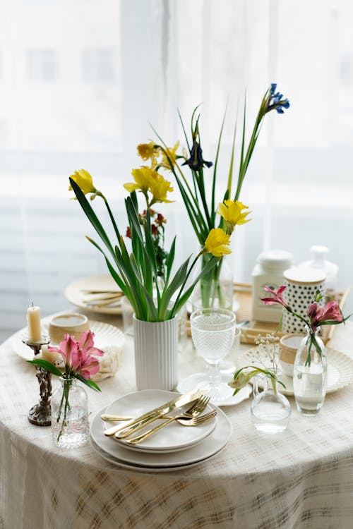 Free Daffodil Flowers on Top of an Elegant Table Setting  Stock Photo