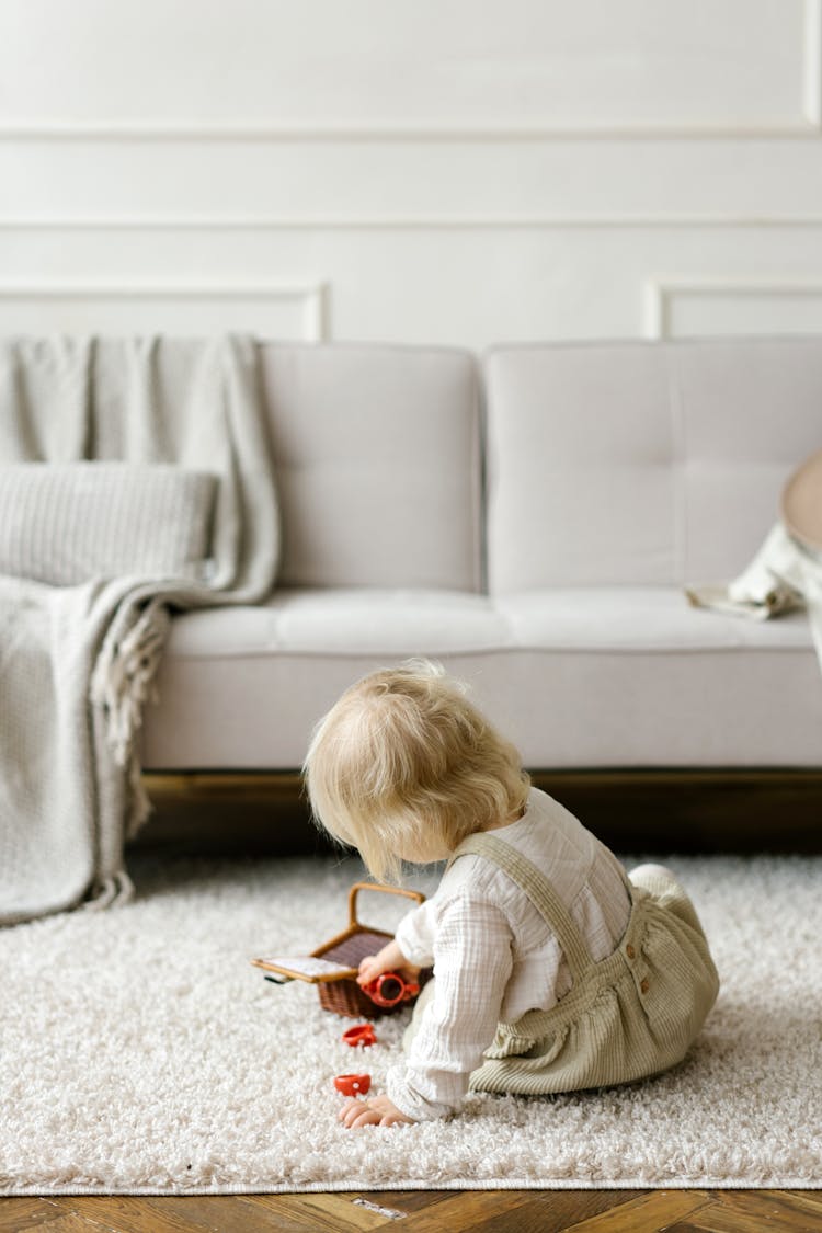 A Girl Playing On The Floor